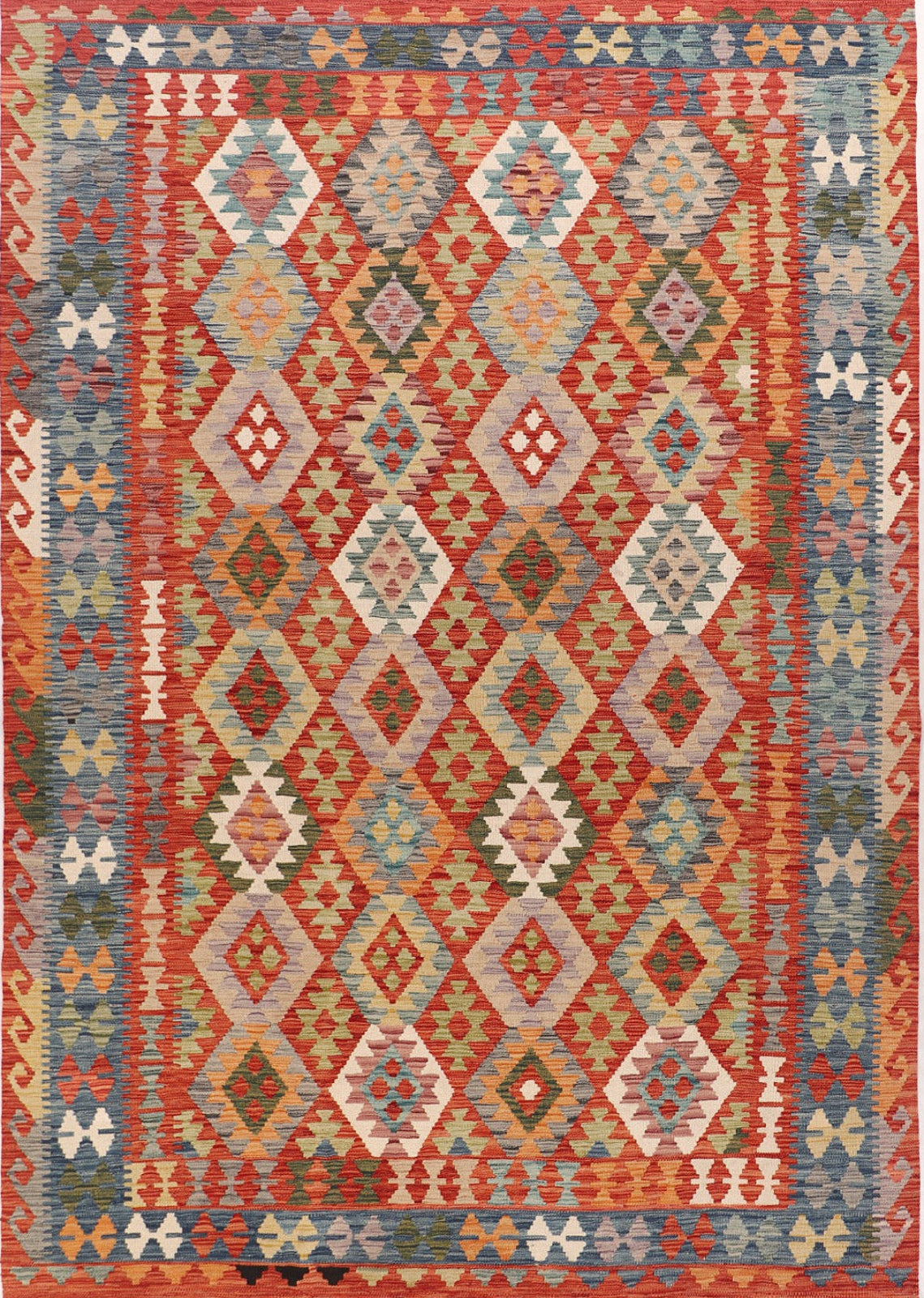 Multicolored geometric patterned rug with red, blue, and beige tones.